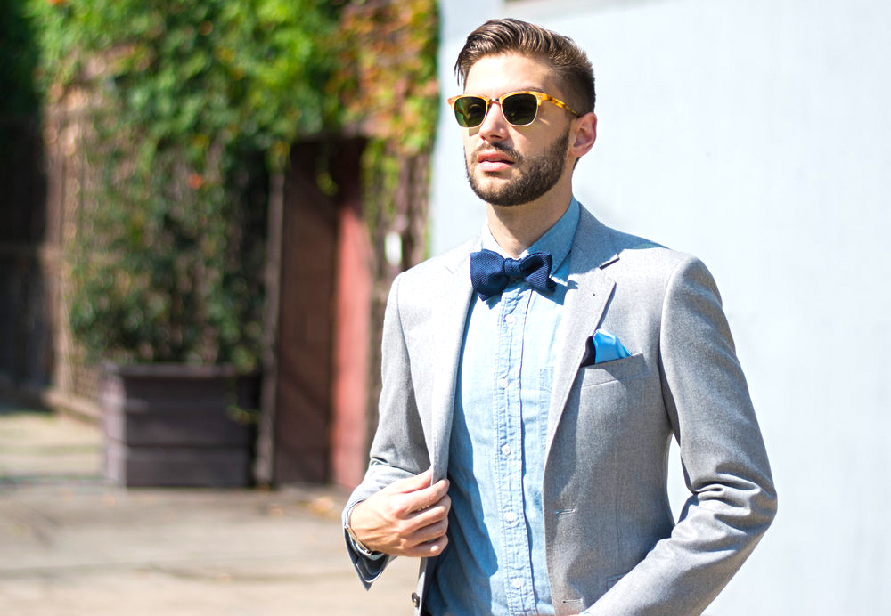 casual attire with a bow tie and pocket square