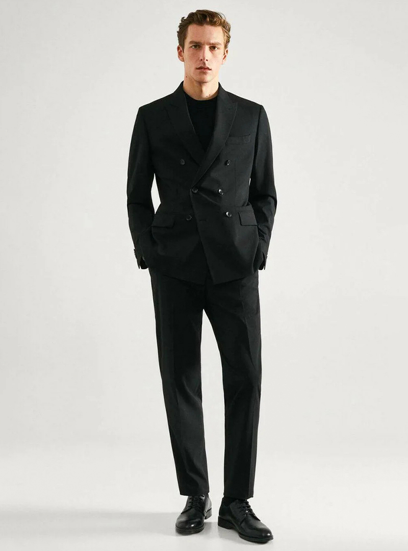 Black double-breasted suit, black sweater and black derby shoes