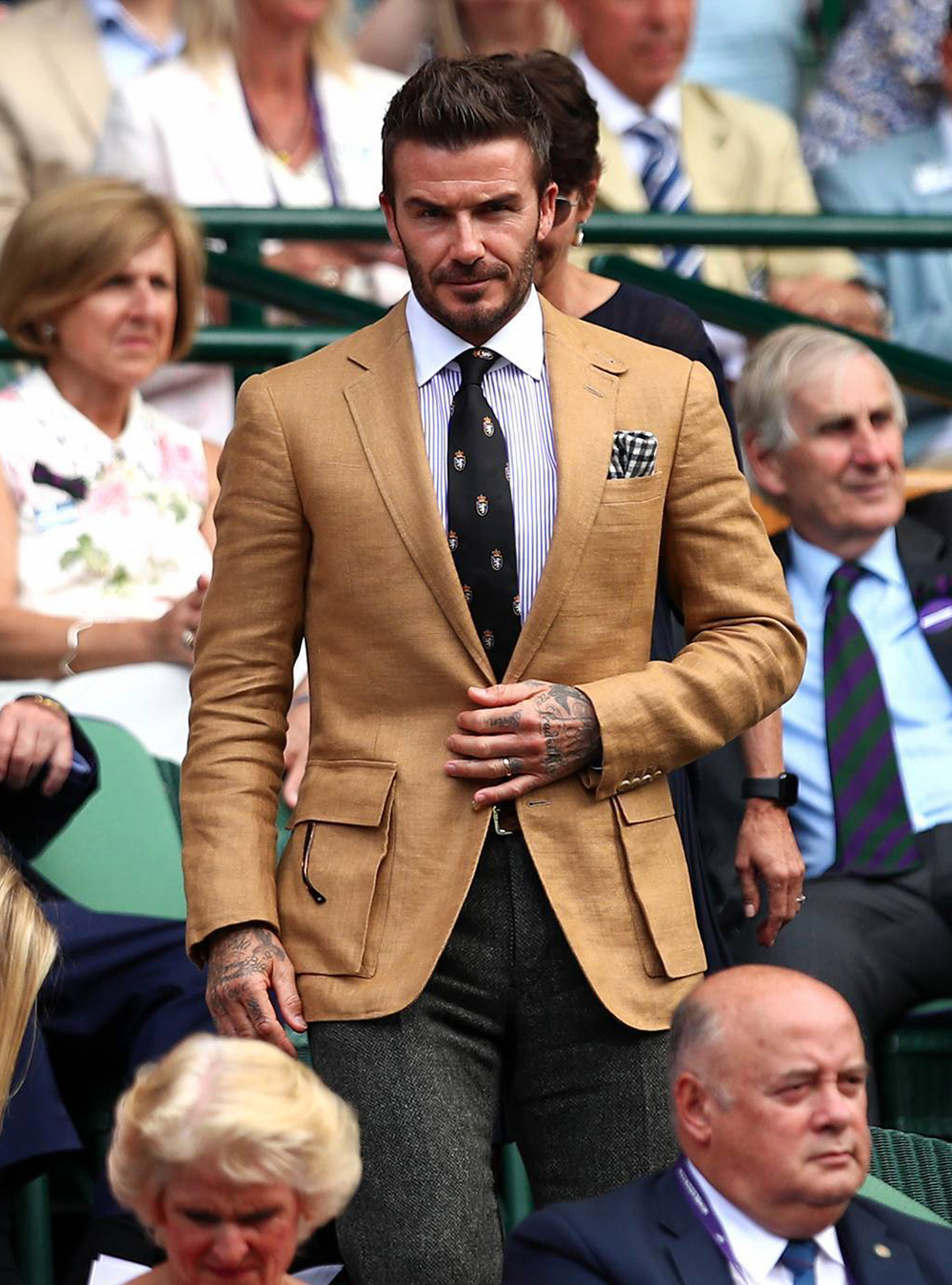 David Beckham wears a light brown blazer