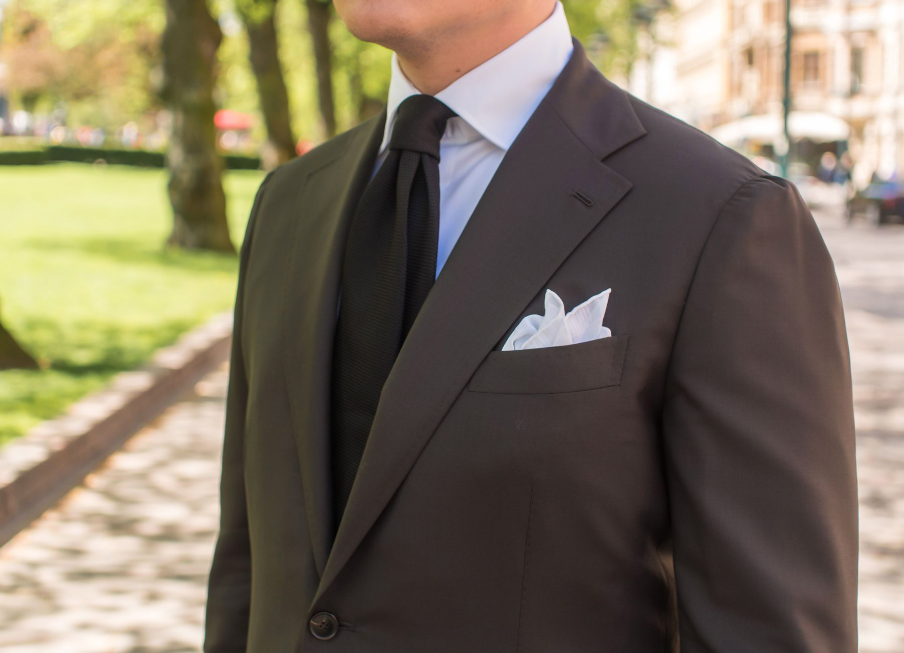 brown suit, white dress shirt and black tie color combination
