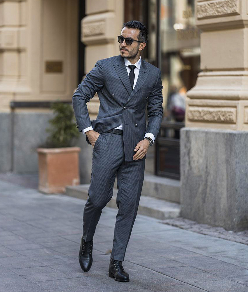 double-breasted grey suit with white shirt and black derby dress boots