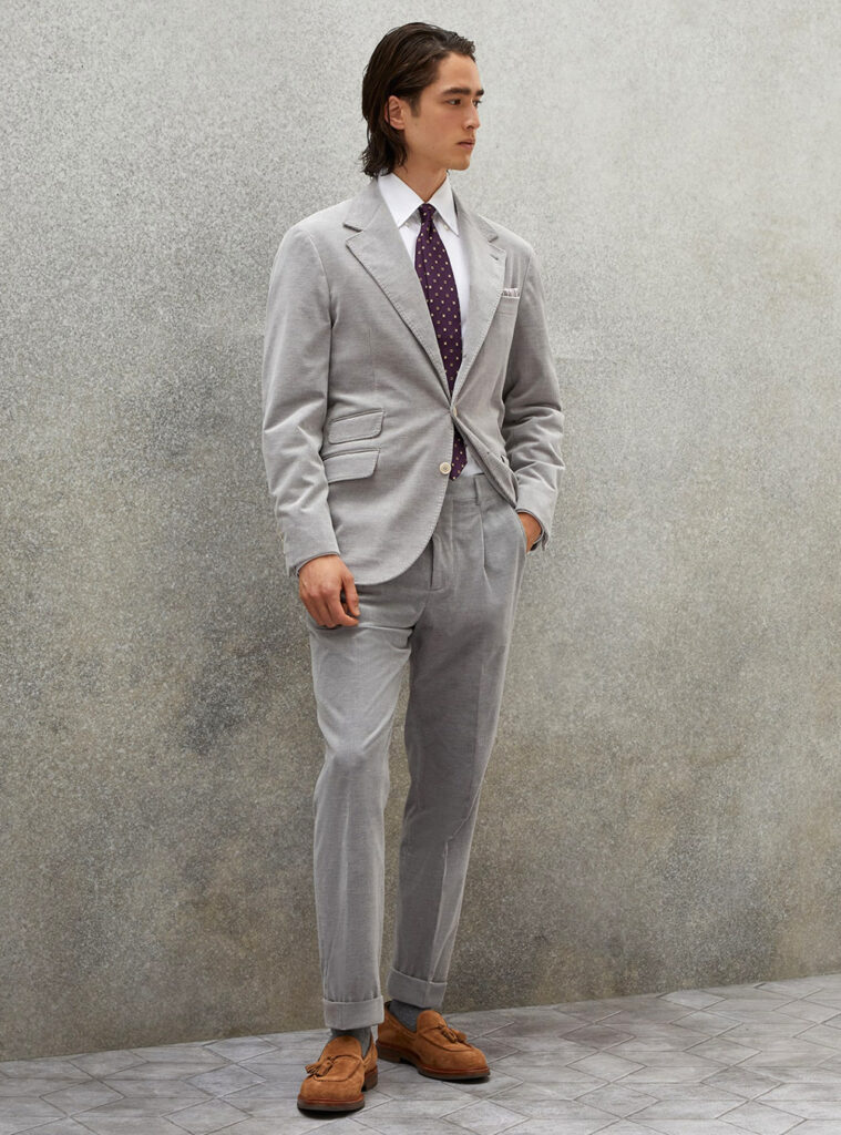 grey suit, white shirt, and brown loafers