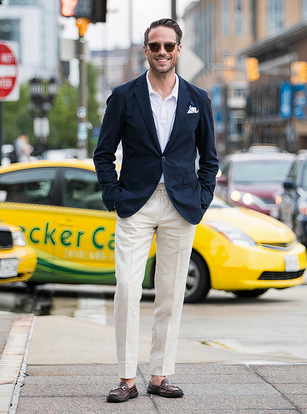 navy blazer, white polo shirt, tan linen pants, and brown leather loafers