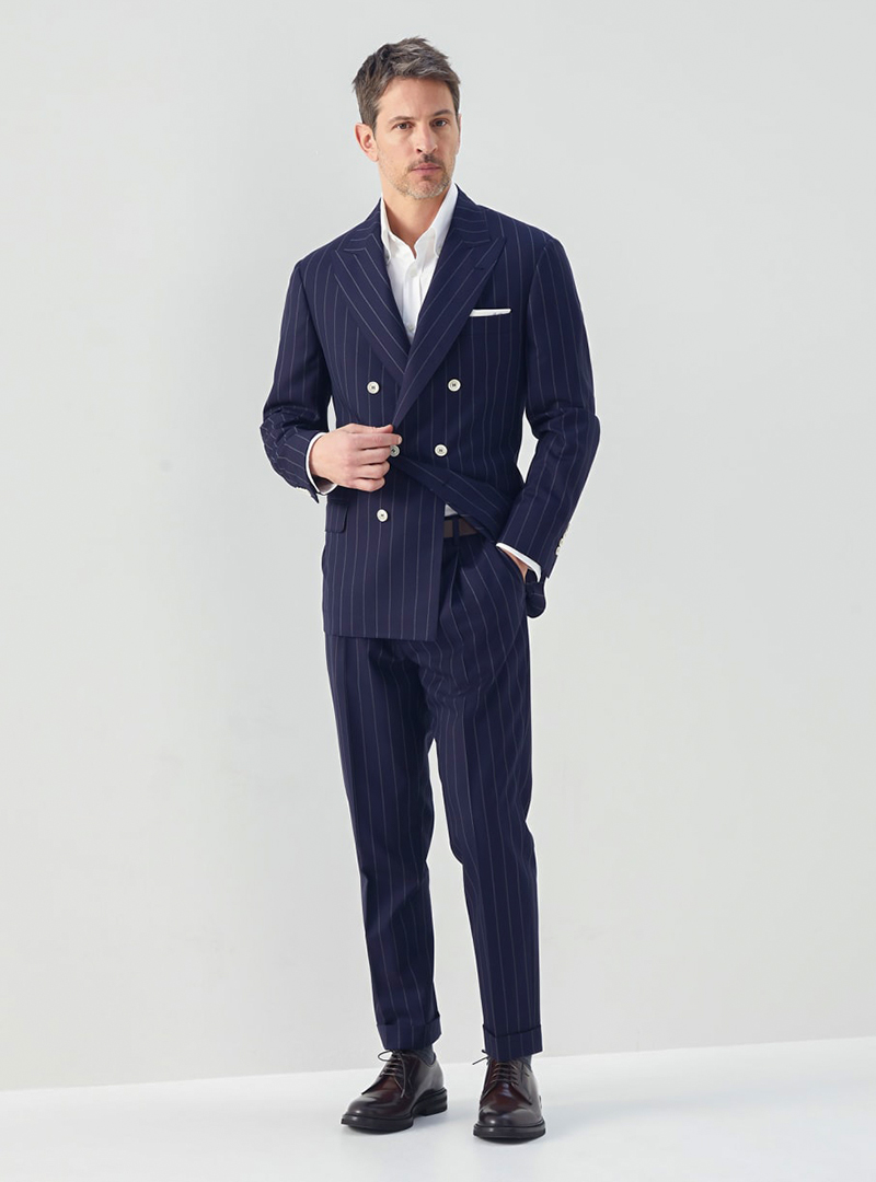 Navy double-breasted suit, white dress shirt and brown derby shoes