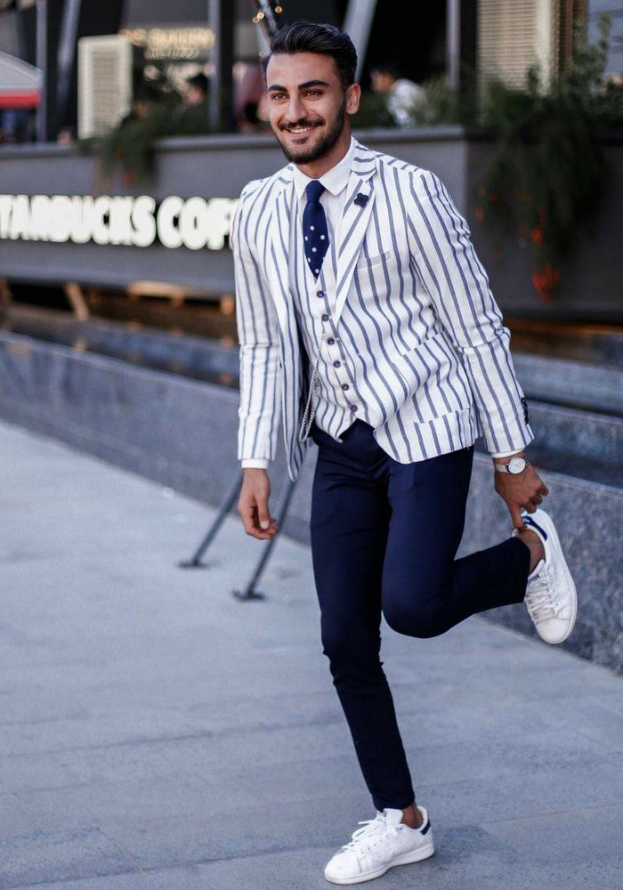 white blue pinstripe suit jacket and sneakers