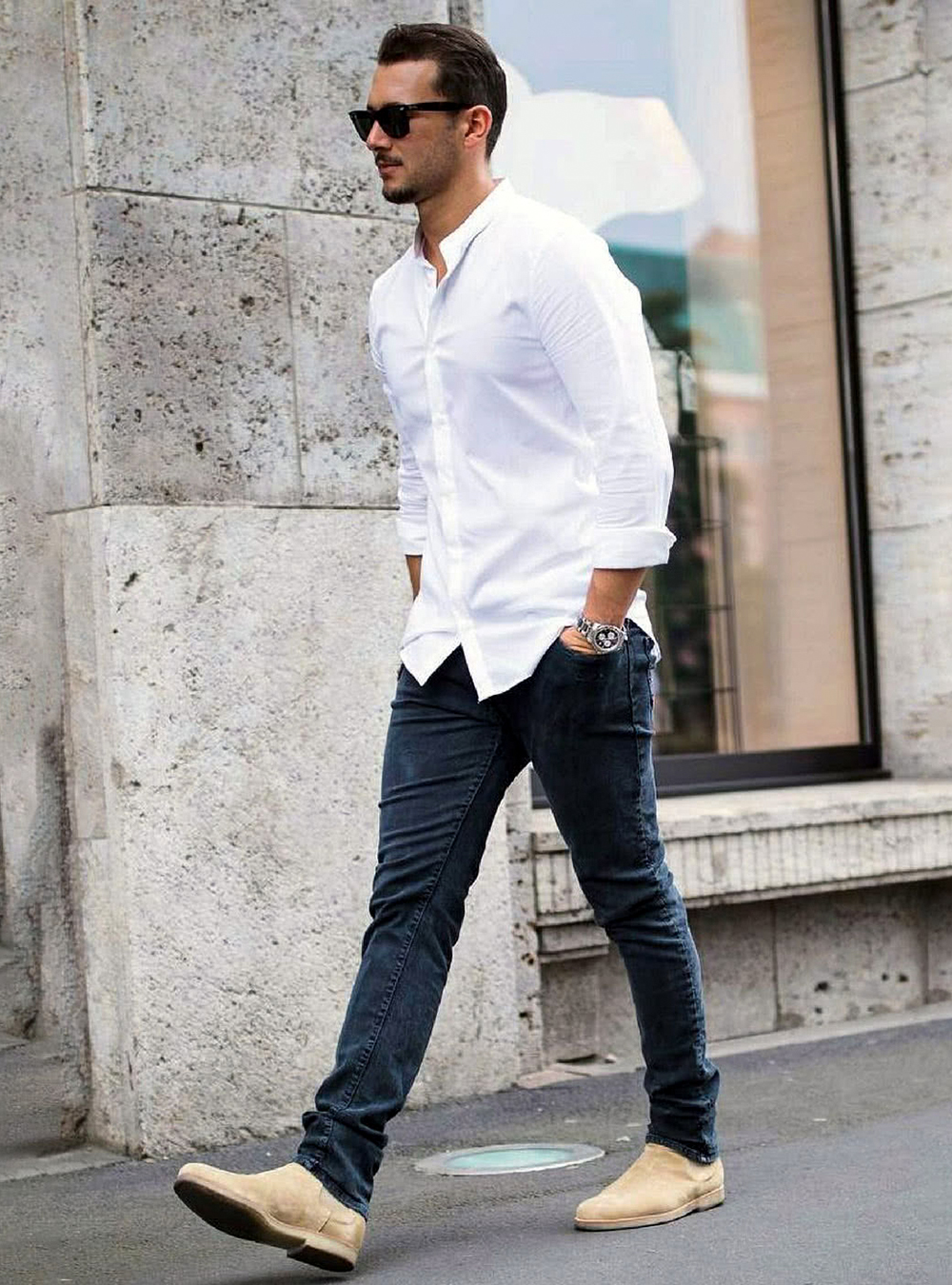 white band collar shirt, dark jeans, and tan suede Chelsea boots